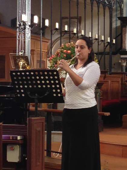 Laura  Morris playing French Horn 